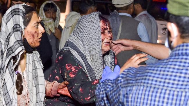 Wounded women arrive at a hospital for treatment after the two blasts. Picture: Wakil Kohsar/AFP