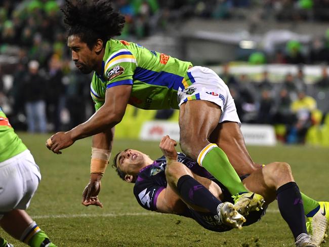 Billy Slater is knocked out by Iosia Soliola.