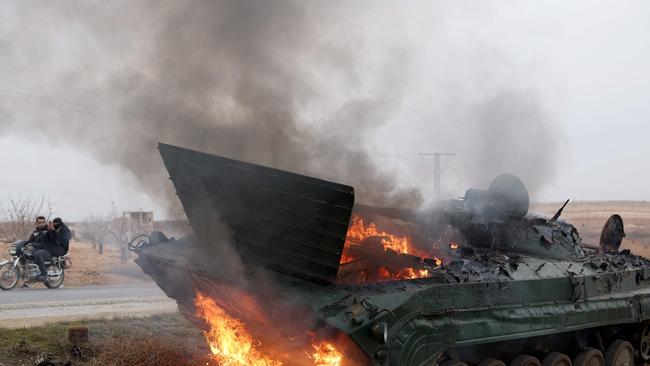 A military vehicle belonging to Syrian regime forces after being seized by anti-government forces. Picture: AFP