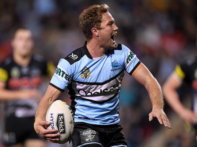 Matt Moylan of the Sharks celebrates after scoring a try during the Round 18 NRL match between the Penrith Panthers and the Cronulla-Sutherland Sharks at Panthers Stadium in Sydney, Friday, July 13, 2018. (AAP Image/Dan Himbrechts) NO ARCHIVING, EDITORIAL USE ONLY