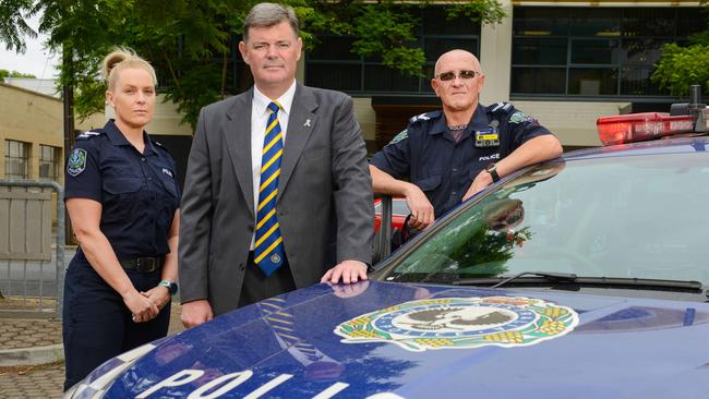 Senior Constables Tash Smith and Paul Jelfs with police association president Mark Carroll. Picture: AAP / Brenton Edwards