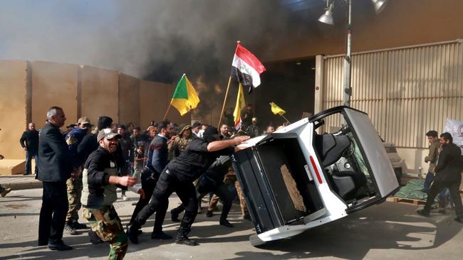 Protesters damage property inside the US embassy compound, in Baghdad, Iraq. Picture: AP