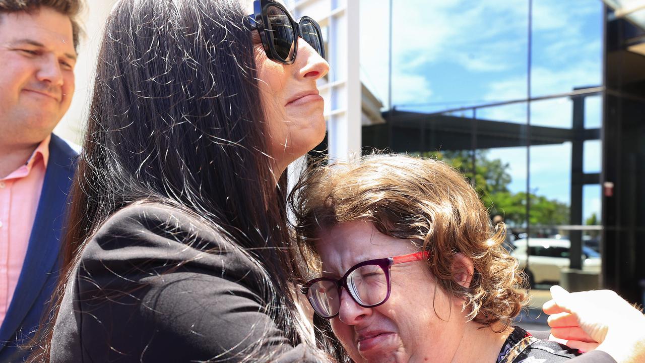 Susan Zimmer’s daughter Claudine Snow, left, hugs a family friend outside court. Picture: Adam Head