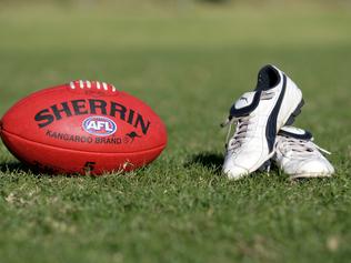 Generic AFL Sherrin football and football boots. sport /