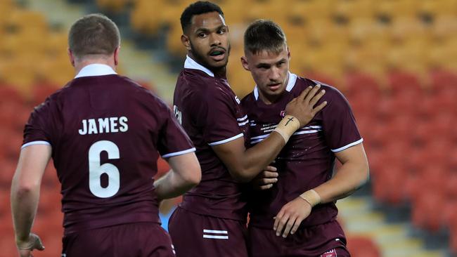 Tristan Powell, pictured with Hamiso Tabuai-Fidow, will be out to use this Queensland Cup to win back a place among the NRL elite. Pics Adam Head