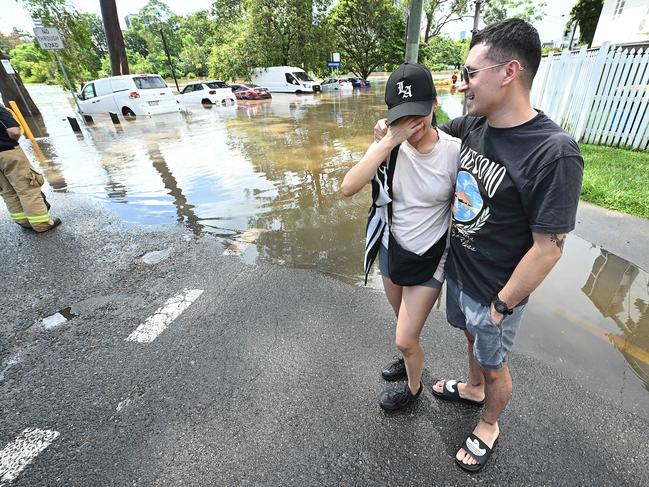 Columbian student Jefrey Guaneme and his partner Luisa Marin lost their car to the flash flooding in Hanlon Park. Picture: Lyndon Mechielsen/Courier Mail