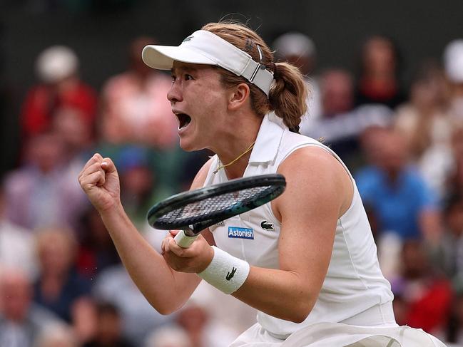 New Zealand's Lulu Sun celebrates winning against Britain's Emma Raducanu during their women's singles fourth round tennis match on the seventh day of the 2024 Wimbledon Championships at The All England Lawn Tennis and Croquet Club in Wimbledon, southwest London, on July 7, 2024. Sun won the match 6-2, 5-7, 6-2. (Photo by HENRY NICHOLLS / AFP) / RESTRICTED TO EDITORIAL USE