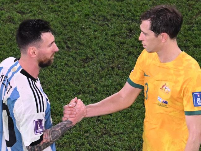 Socceroo Craig Goodwin (right) shakes hands with Argentina's Lionel Messi after Australia’s World Cup-ending 2-1 loss. Picture: Kirill KUDRYAVTSEV / AFP