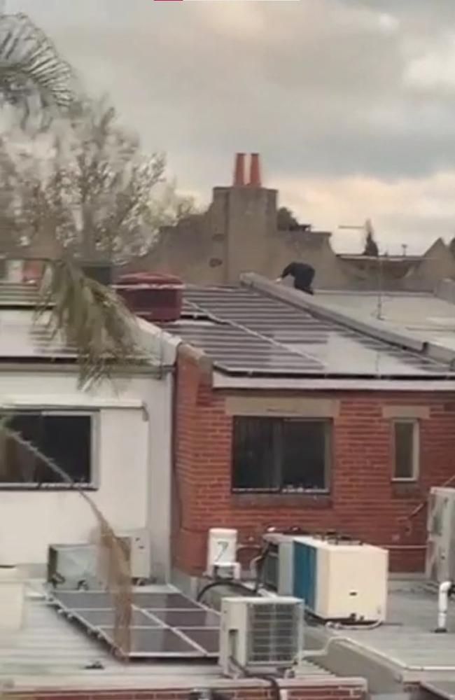 A video circulating in Melbourne shows people climbing across buildings to allegedly get into a synagogue.