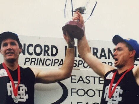 Derek Coghlan and Alan Richardson celebrate East Burwood’s 1999 premiership. Picture: Supplied