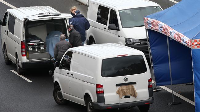 Police and emergency services at the crime scene on the Eastern Freeway in 2019. Picture: David Crosling