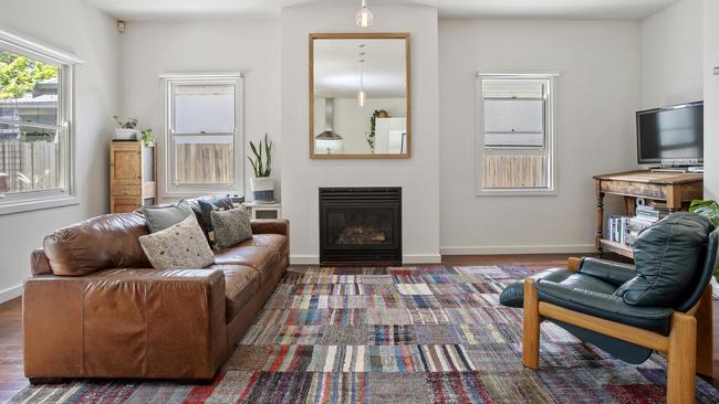 A gas log fire adds ambience in the living room.