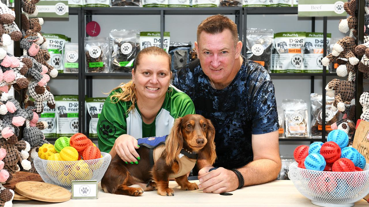 Ground Floor Dog Treats owners Linda and Paul Welsh with Paul's Assistance dog, Milo, have opened their doors at Townsville Shopping Centre. Picture: Shae Beplate.