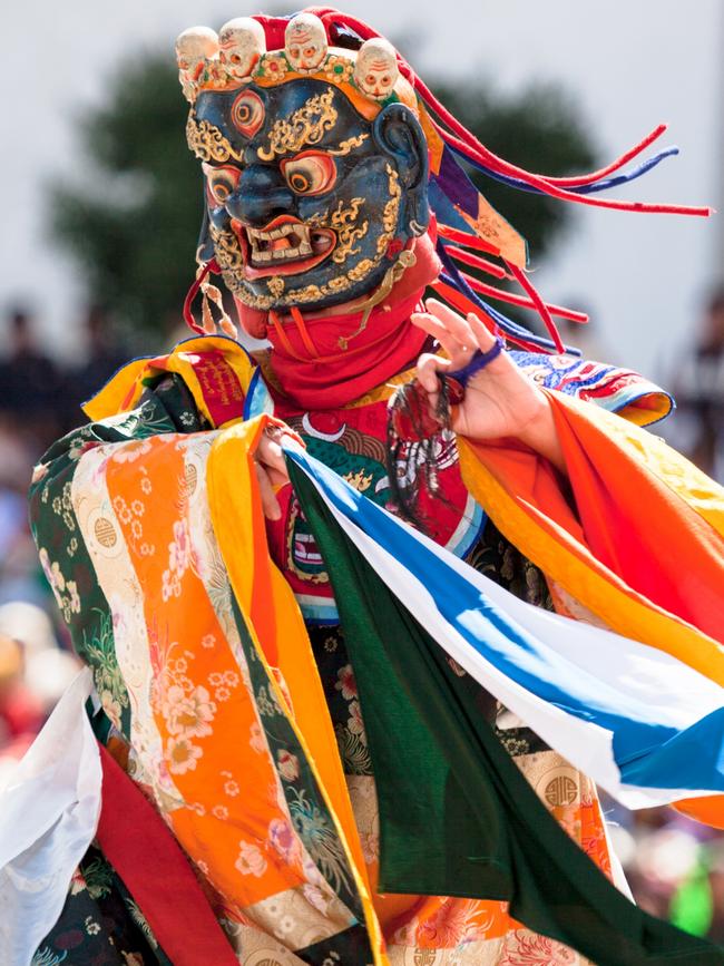 Traditional dance at festival in the Timphu Dzong. Each year one of the major festivals is held in the Dzong of Thimphu. People from all the surrounding valleys gather during 3 days to watch all the traditional dances.