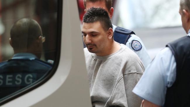 James 'Dimitrious' Gargasoulas is seen with a heavy police escort as he leaves the Supreme Court of Victoria in Melbourne last Friday. Picture: David Crosling/AAP