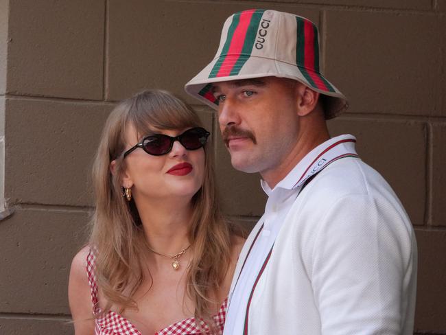 TOPSHOT - US musician Taylor Swift (L) and US NFL football player Travis Kelce (R) attend the men's final match between Italy's Jannik Sinner and USA's Taylor Fritz on day fourteen of the US Open tennis tournament at the USTA Billie Jean King National Tennis Center in New York City, on September 8, 2024. (Photo by TIMOTHY A. CLARY / AFP)