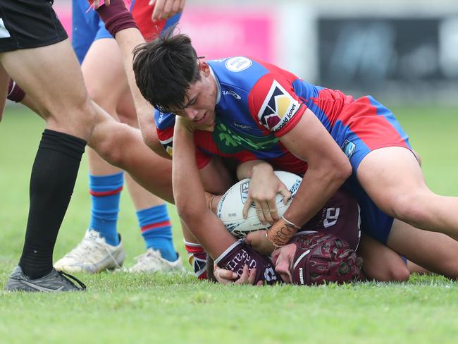 Beau Alexander is held down by Kyran Blair. Picture: Sue Graham