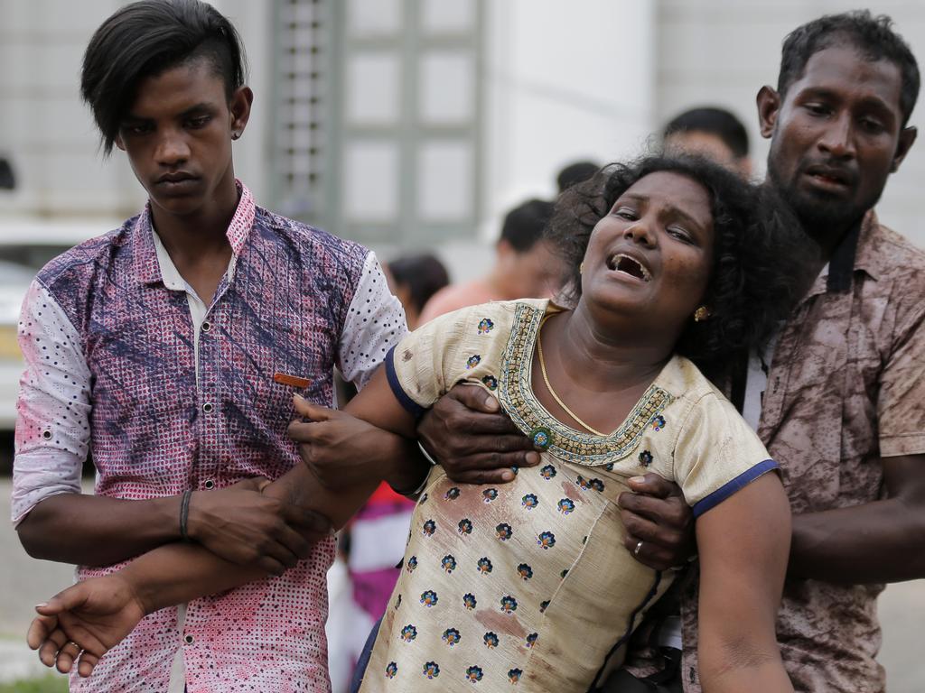 Relatives of a blast victim grieve outside a morgue in Colombo. Picture: Eranga Jayawardena