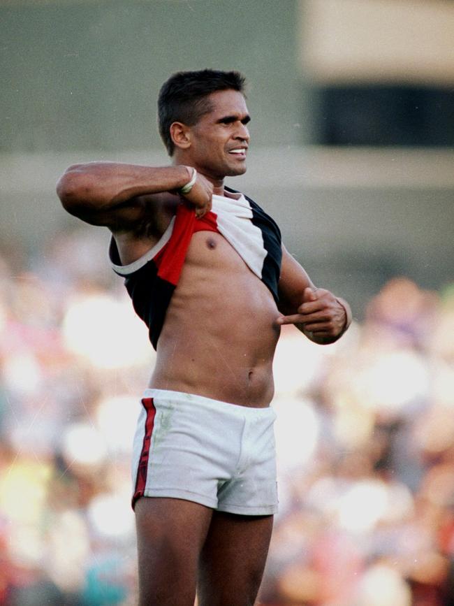 Nicky Winmar in his famous gesture in 1993. Picture: Wayne Ludbey