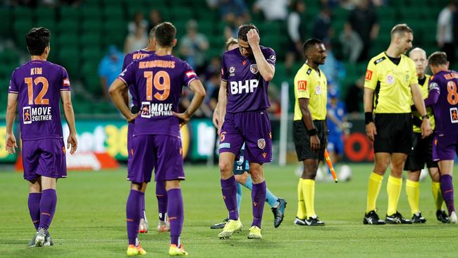 Perth Glory players look dejected after their 3-1 home defeat to Sydney FC last Saturday. Picture: AAP