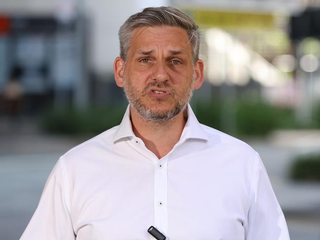 Greens MP Michael Berkman who retained the inner city seat of Maiwar talks at a press conference at Milton Common on Sunday. Picture Lachie Millard