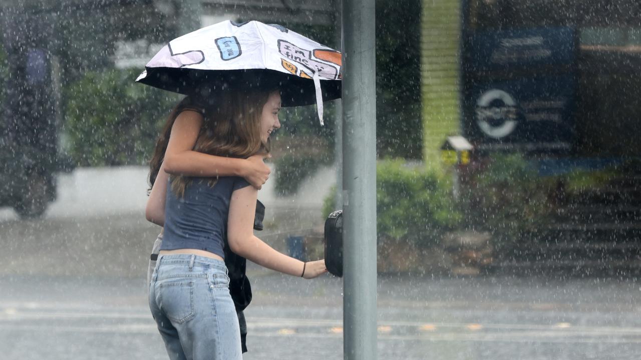 A sudden downpour of rain caught a lot of people out and caused flashed flooding around Brisbane. Picture David Clark