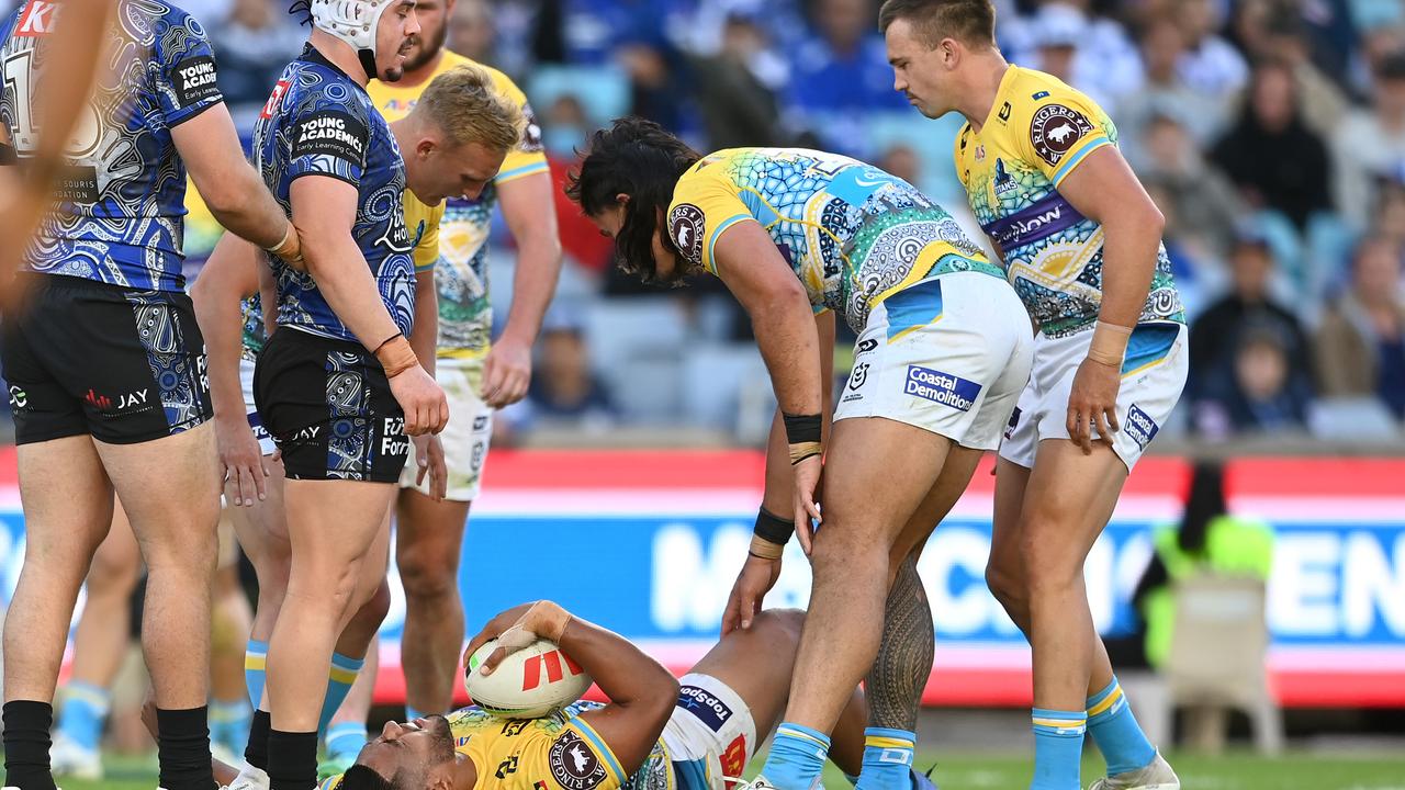 Reed Mahoney stands over Gold Coast Titans player Moeaki Fotuaika before being penalised for a ‘hip drop’ tackle. Picture: NRL PHOTOS