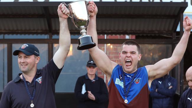 Ormond coach Ash Lever lifts the cup with captain Tom Buckley after their win in the VAFA Division 1 grand final. Picture: David Crosling