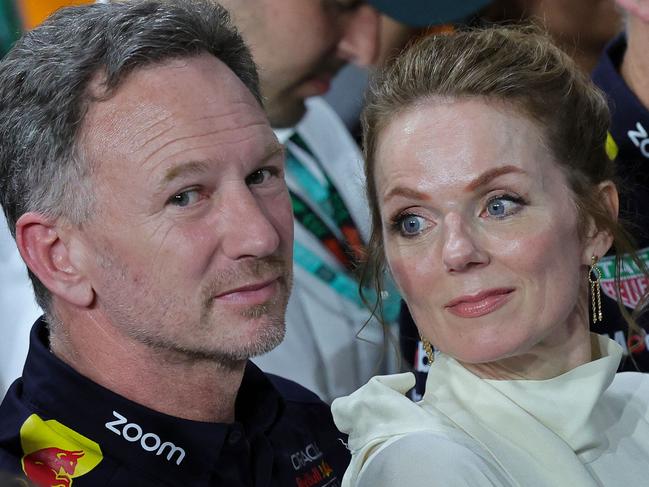 Red Bull Racing team principal Christian Horner (L) along with his wife British singer Geri Halliwell attends the podium ceremony of the podium ceremony of the Saudi Arabian Formula One Grand Prix at the Jeddah Corniche Circuit in Jeddah on March 9, 2024. (Photo by Giuseppe CACACE / AFP)