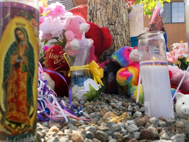 A memorial for a 10-year-old girl who police said was sexually assaulted, strangled then dismembered is seen at an Albuquerque. Picture: AP
