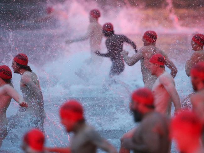 Nude swimmers hit the water with a splash. Picture: NIKKI DAVIS-JONES