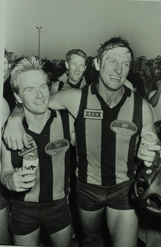 Maroochydore players Grant Keating and Peter Kerr celebrate winning the 1986 grand final. Copy by Warren Lynam