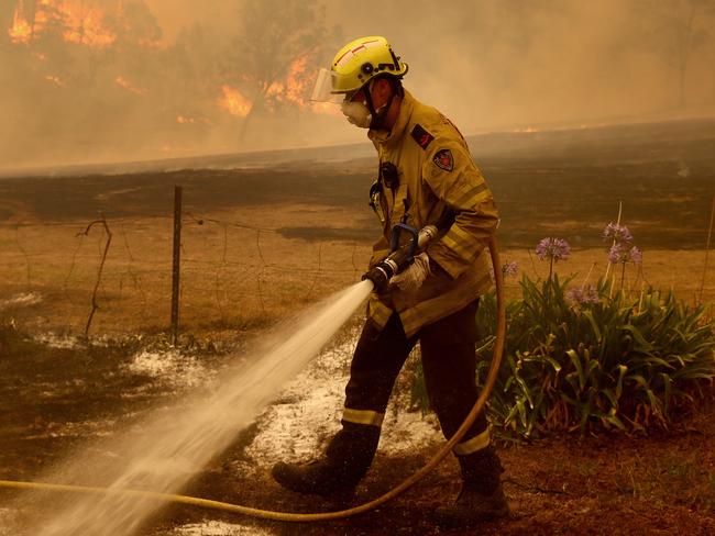 Bushfires on the South Coast of NSW. Fire and Rescue NSW firies put out spot fires in the Bega Valley near Wyndham. Picture: Toby Zerna