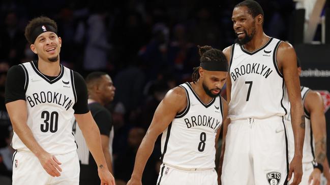 End of the road? Patty Mills and Kevin Durant embrace during their time together at Brooklyn.