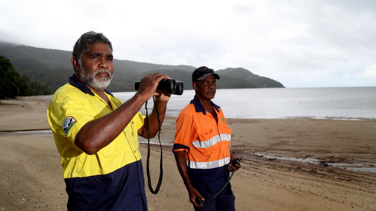 Gunggandji Land and Sea Ranger Jansen Yeatman and Vincent Schriber on the beach at Yarrabah. Picture: Stewart McLean