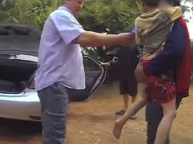 Father Gordon approaches his son with a toy. Picture: CARI/YouTube.