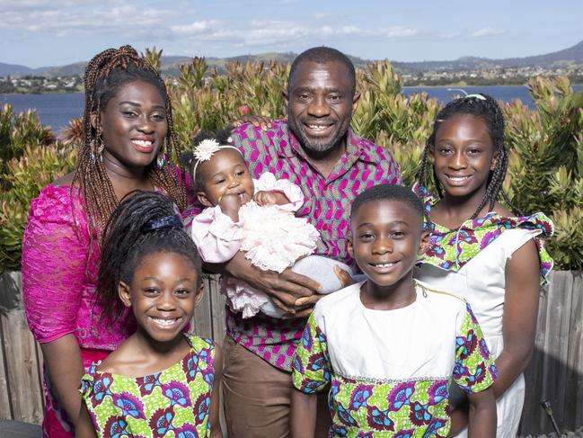 John Kamara lives with the trauma of his childhood being shattered by civil war, but he is thankful he now lives in Tasmania, where it is safe to raise a family of his own. L-R: John’s wife Mavis Quansah-Kamara, daughter Jonavia, 6, John holding daughter Joneva, 7 months, son John-Zion, 9, and daughter Jonievis, 11. Picture: Eddie Safarik