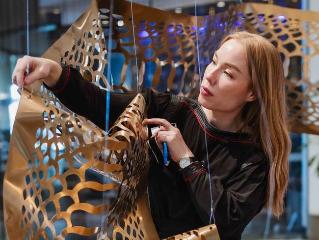 Elysha Rei with her work (Seijaku): Photograph: PixelPunk 2025, courtesy the artist.