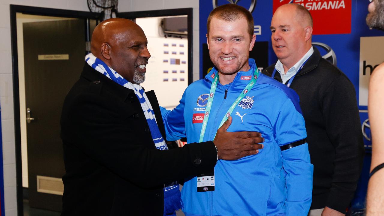 MELBOURNE, AUSTRALIA - JULY 16: CEO Ben Amarfio and Leigh Adams, Interim Senior Coach of the Kangaroos celebrate during the 2022 AFL Round 18 match between the North Melbourne Kangaroos and the Richmond Tigers at Marvel Stadium on July 16, 2022 in Melbourne, Australia. (Photo by Michael Willson/AFL Photos via Getty Images)