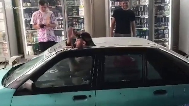 Youtubers RackaRacka head through the drive through at the Lonsdale Hotel in a car filled with water. Picture: ShitAdelaide via Instagram