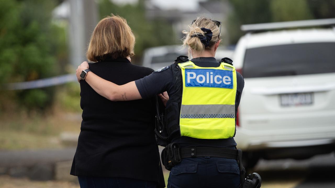 A woman, who was heard wailing at the scene, was taken away in an ambulance and treated for shock. Picture: Nicki Connolly