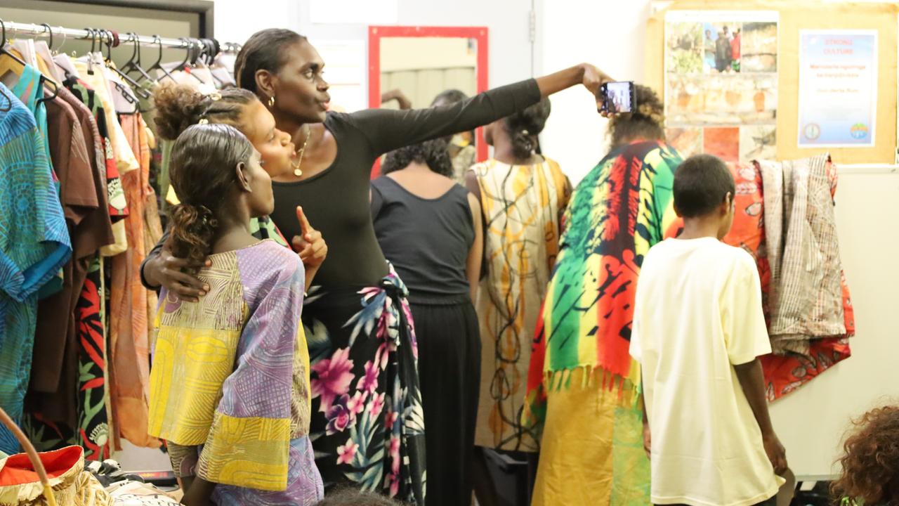 Local aspiring models take the chance to snap a selfie with international catwalk star Maminydjama (Magnolia) Maymuru during the festival’s fashion show. Picture: NLC