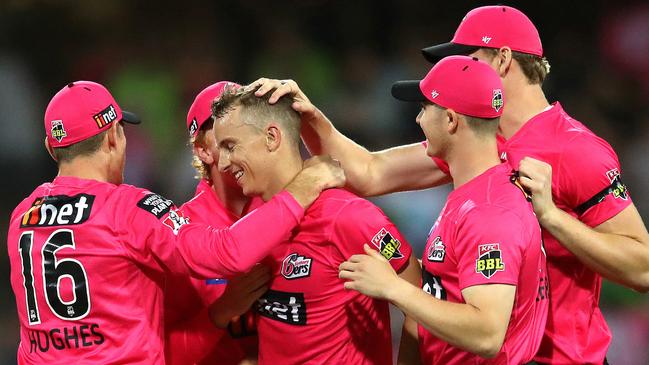 Sixers players congratulate Tom Curran after they beat the Thunder in the Super Over. Picture. Phil Hillyard