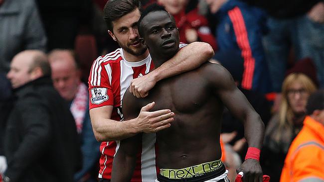 Southampton's Sadio Mane (R) celebrates scoring his team's third goal.