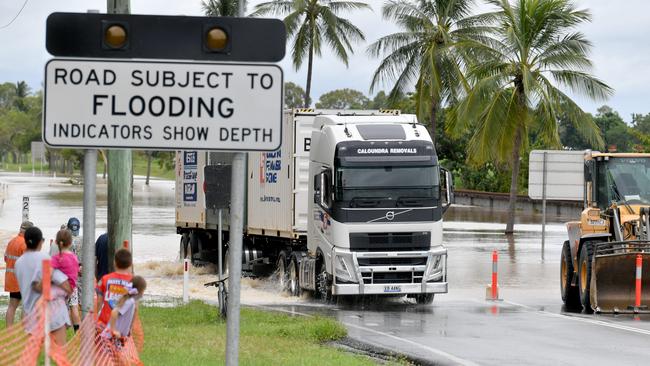 Sunday February 9. Heavy rain causes flooding in North Queensland. Flooding at Plantation Creek in Ayr cuts Bruce Highway to traffic apart from trucks. Picture: Evan Morgan