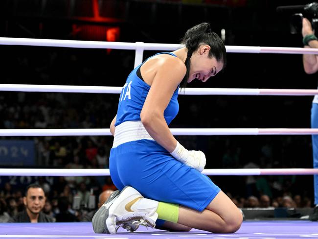 Italy's Angela Carini sobs in the centre of the ring after her bout with Algeria's Imane Khelif. Picture: AFP