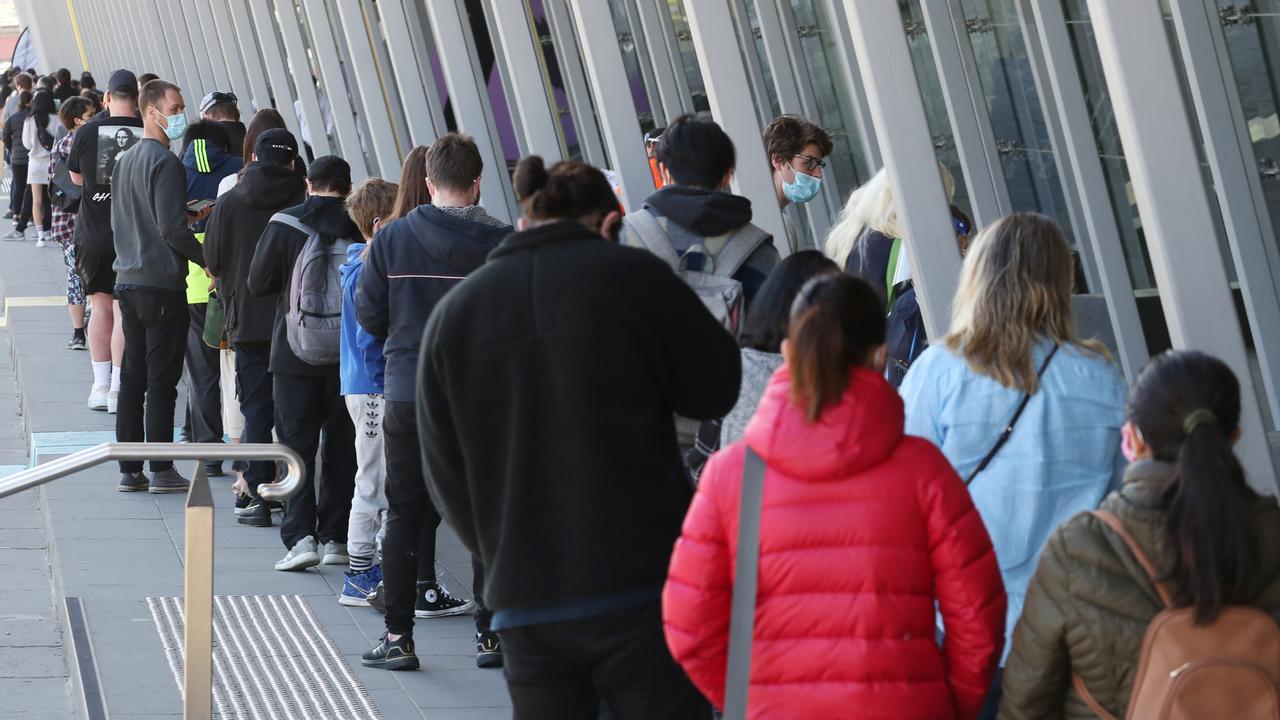 People line up to get their Covid vaccinations at the Melbourne Exhibition Centre. Picture: NCA NewsWire / David Crosling