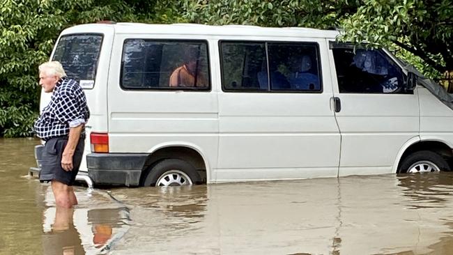 Barry Roberts helping during the flooding in March. Picture: Margie Pratt