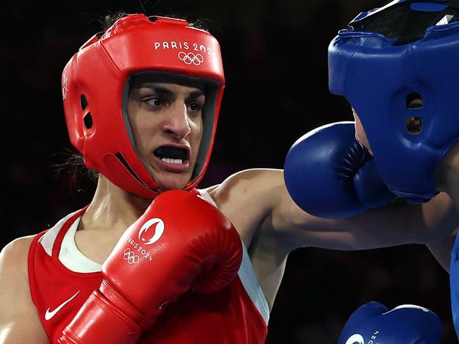 PARIS, FRANCE - AUGUST 09: Imane Khelif of Team Algeria punches Liu Yang of Team People's Republic of China during the Boxing Women's 66kg Final match on day fourteen of the Olympic Games Paris 2024 at Roland Garros on August 09, 2024 in Paris, France. (Photo by Richard Pelham/Getty Images)