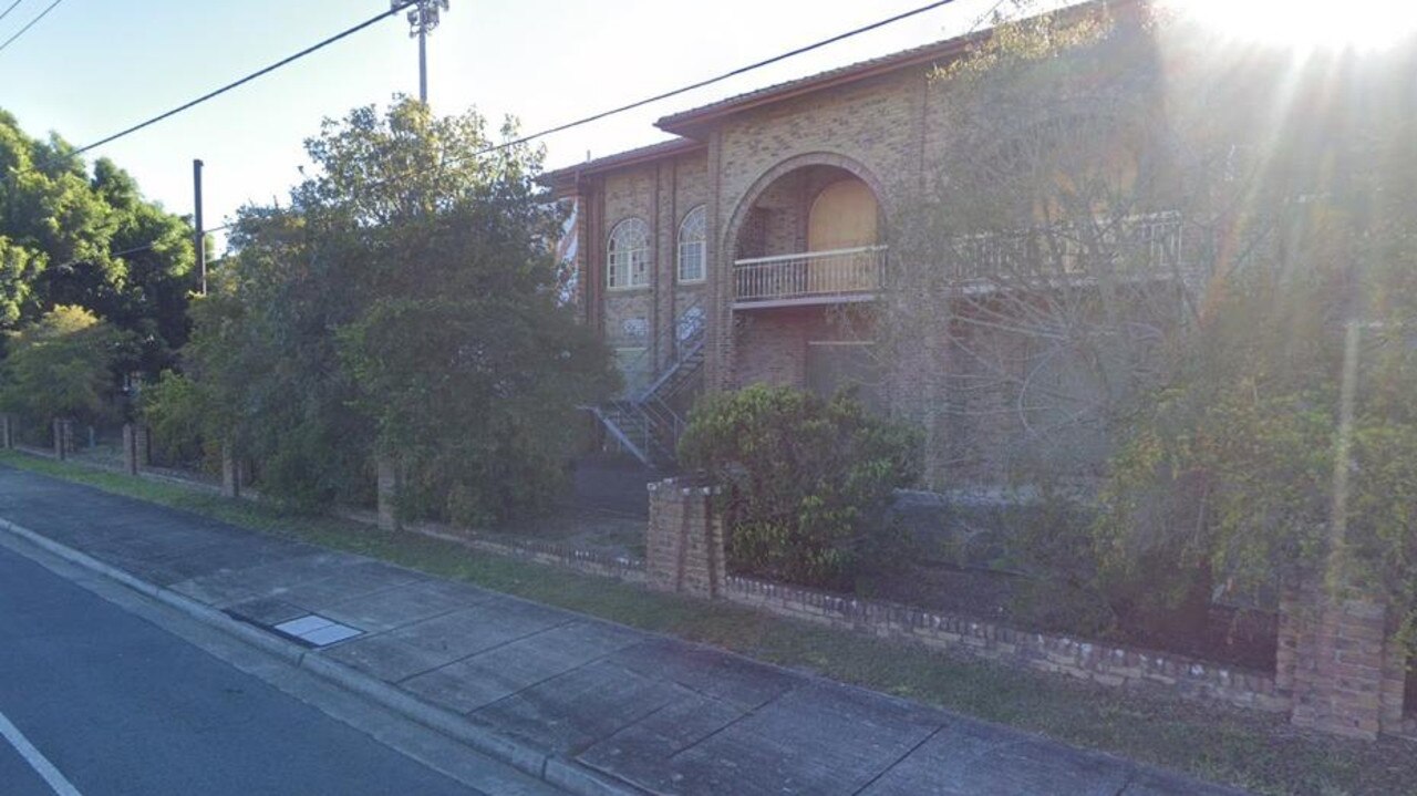 Fire Department officers were called to the site in February this year after smoke billowed out of the broken windows. A month later Logan City Council said it would demolish the building as it was now regarded as dangerous. Picture: Judith Kerr